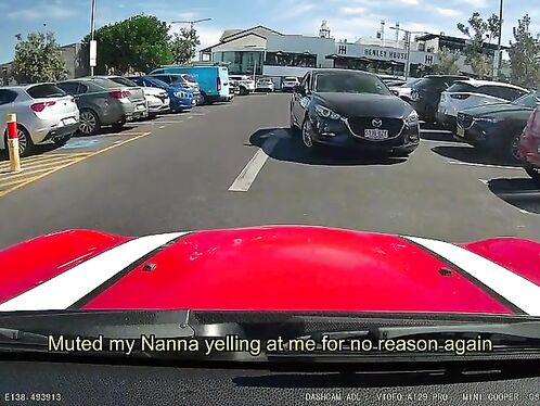 Driver cuts off car in parking lot battle