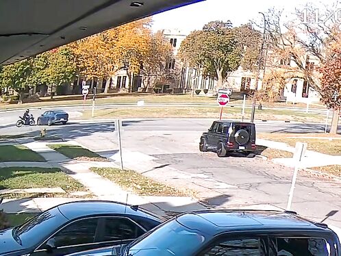 Man drives SUV through a residential roundabout
