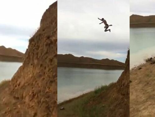Man slips and falls into a lake while walking