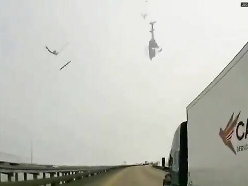 Helicopter crashes on highway