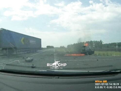 Truck bursts into flames in the middle of a highway