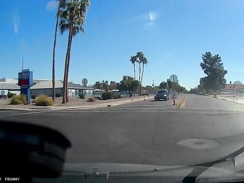 Car runs stop sign and narrowly misses collision