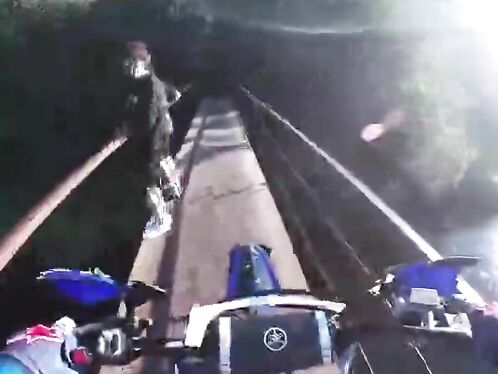 Cyclist accidentally crashes through bridge barrier