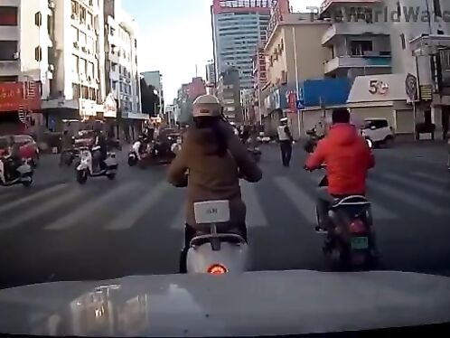 Bull crashes into moped rider
