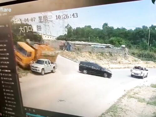 Pedestrian barely escapes being hit by truck