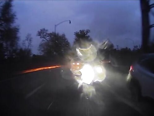 Driver flashes high beams in rainy conditions