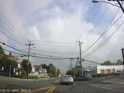 A car gets sucked into a tornado on a residential street