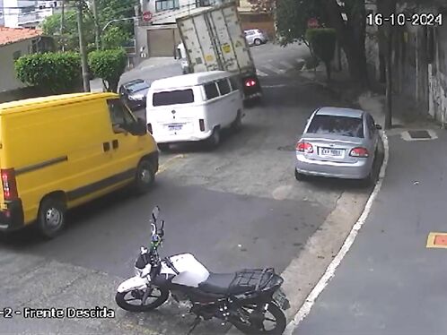 Van loses cargo as it turns around a tight corner