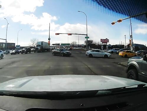 Driver runs red light despite traffic backup