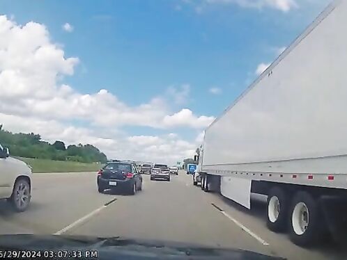 Two cars cut off each other on the highway in a close call