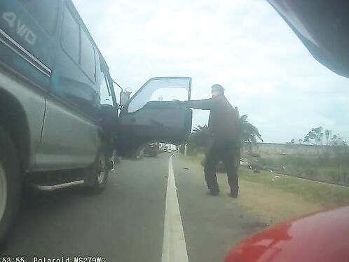 Pedestrian strikes man sitting on car hood during road rage