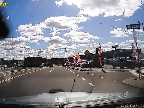 Car crashes into security pole at intersection