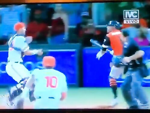 Baseball players brawl at home plate after a play