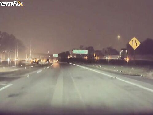 Car goes airborne after hitting semi