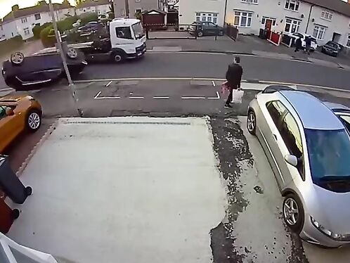 Driver fails to park and hits car in driveway