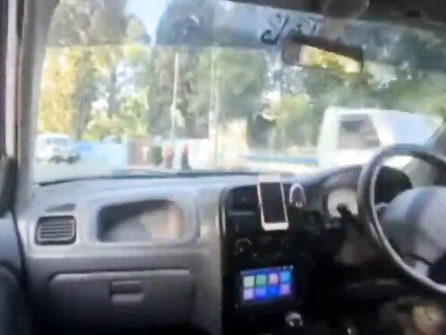 Driver types on a keyboard while cruising in the fast lane