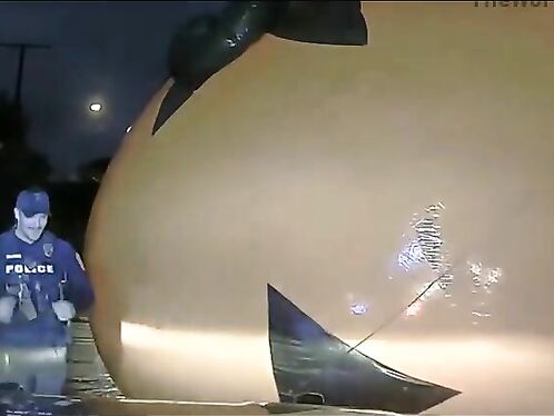 Cop battles giant inflatable pumpkin