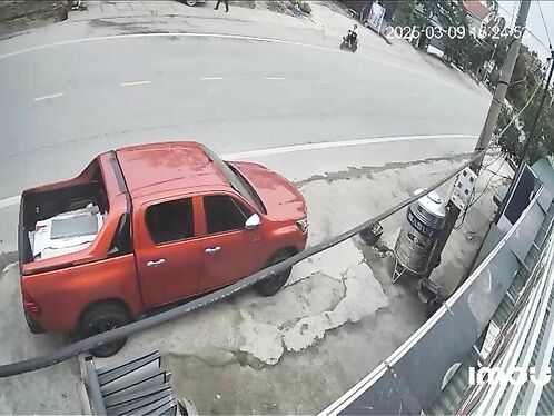 Red truck gets stuck on sidewalk after failed turn