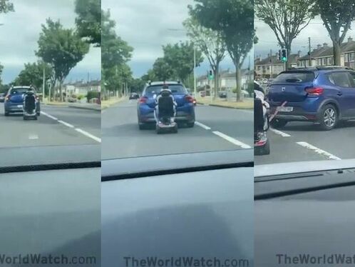 Driver turns left and cuts off a motor scooter
