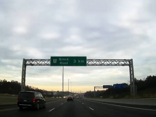 Car suddenly stops on highway, causing traffic backup