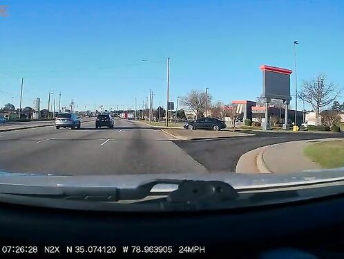 SUV spins out and loses control in parking lot