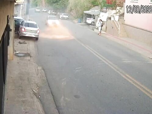 Car skids out of control on steep urban street