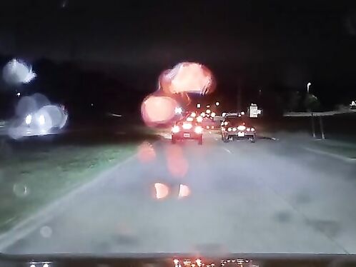 Driver narrowly avoids collision with spinning car on road