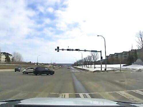 Driver runs red light and crashes into another car