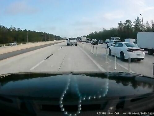 Drifting truck narrowly misses fender-bender on highway