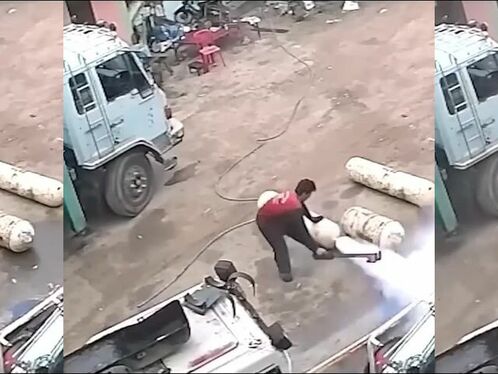 Truck accidentally drives over items in the road