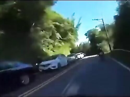 Biker flies through air in failed overtake and hits car