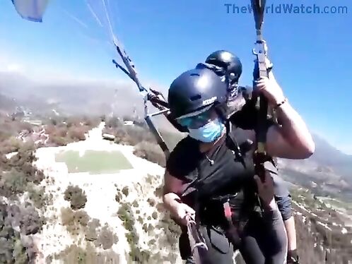 Instructor dragged by paraglider