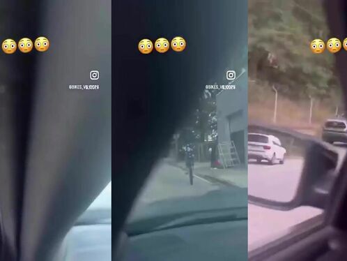 Person falls off bike while trying to cross street