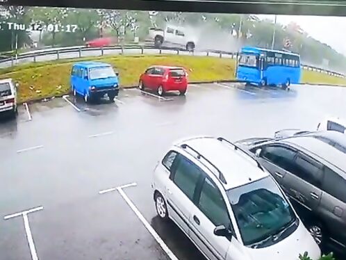 White truck plows into parked cars and a bus