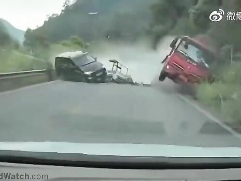 Truck skids out of control on a winding forest road