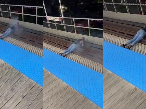 Man slips and slides on wet dock surface