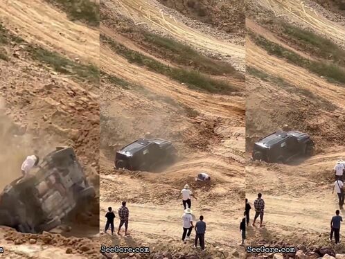 SUV tumbles down steep dirt hill with spectators watching