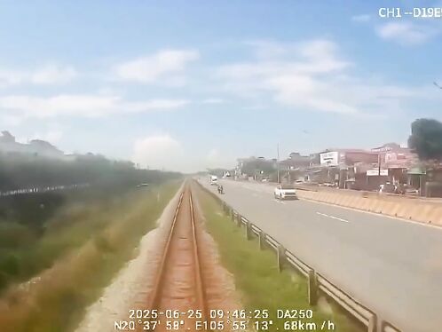 Near-miss: Man on bike crosses busy railroad tracks