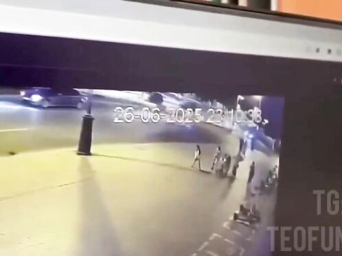 Man crosses street while cars swerve to miss him.