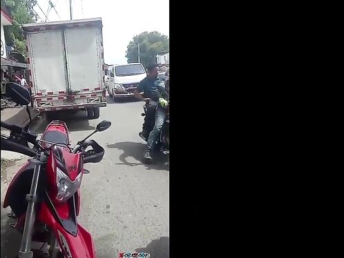 Crowd attacks motorcyclist with a refrigerator