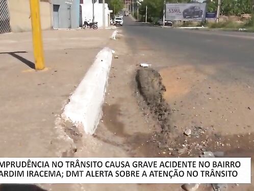 Two people lie injured on the road after an accident