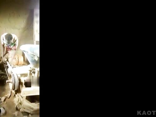 Man struggles with jammed grinding machine and nearly loses his hand