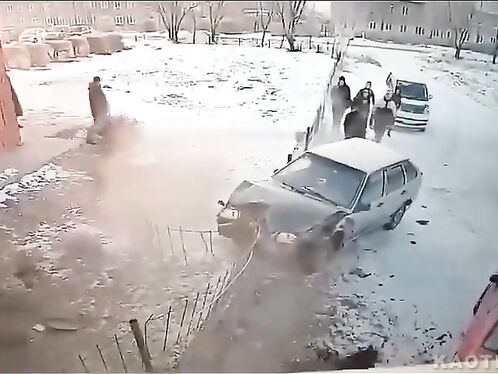 Car crashes into fence and flips onto its side