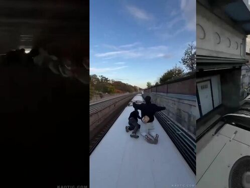 Couple hangs off moving train for selfie