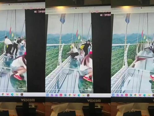 Tourists fall from glass walkway