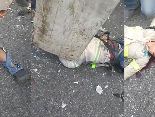 Injured firefighter lies on the ground after an accident