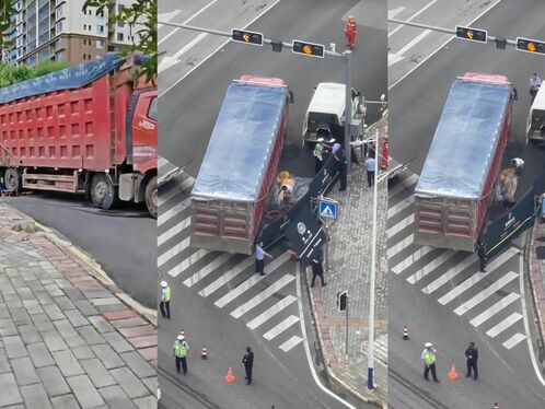 Truck driver accidentally drives onto sidewalk and gets stuck