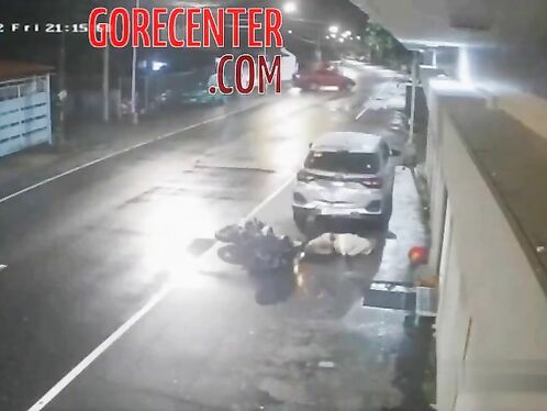 Car hits motorcycle on rainy road, bad accident