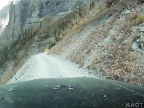 Red SUV rolls over after hitting a bump on dirt road