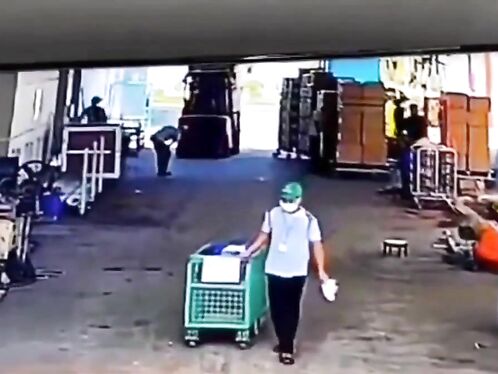 Worker drops heavy object on himself and falls over
